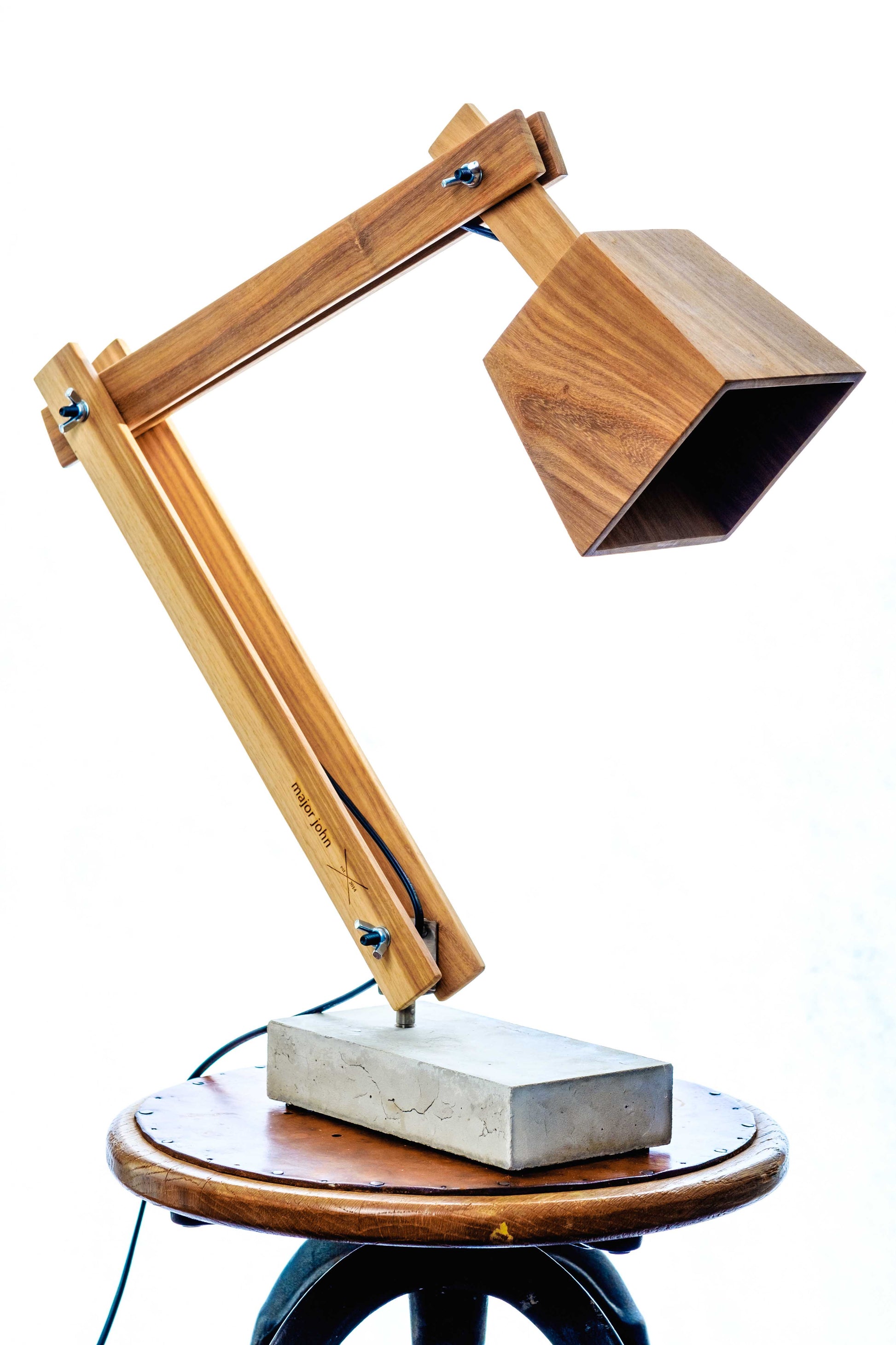 Namibian Teak Timber and Concrete Desk Lamp on a white background