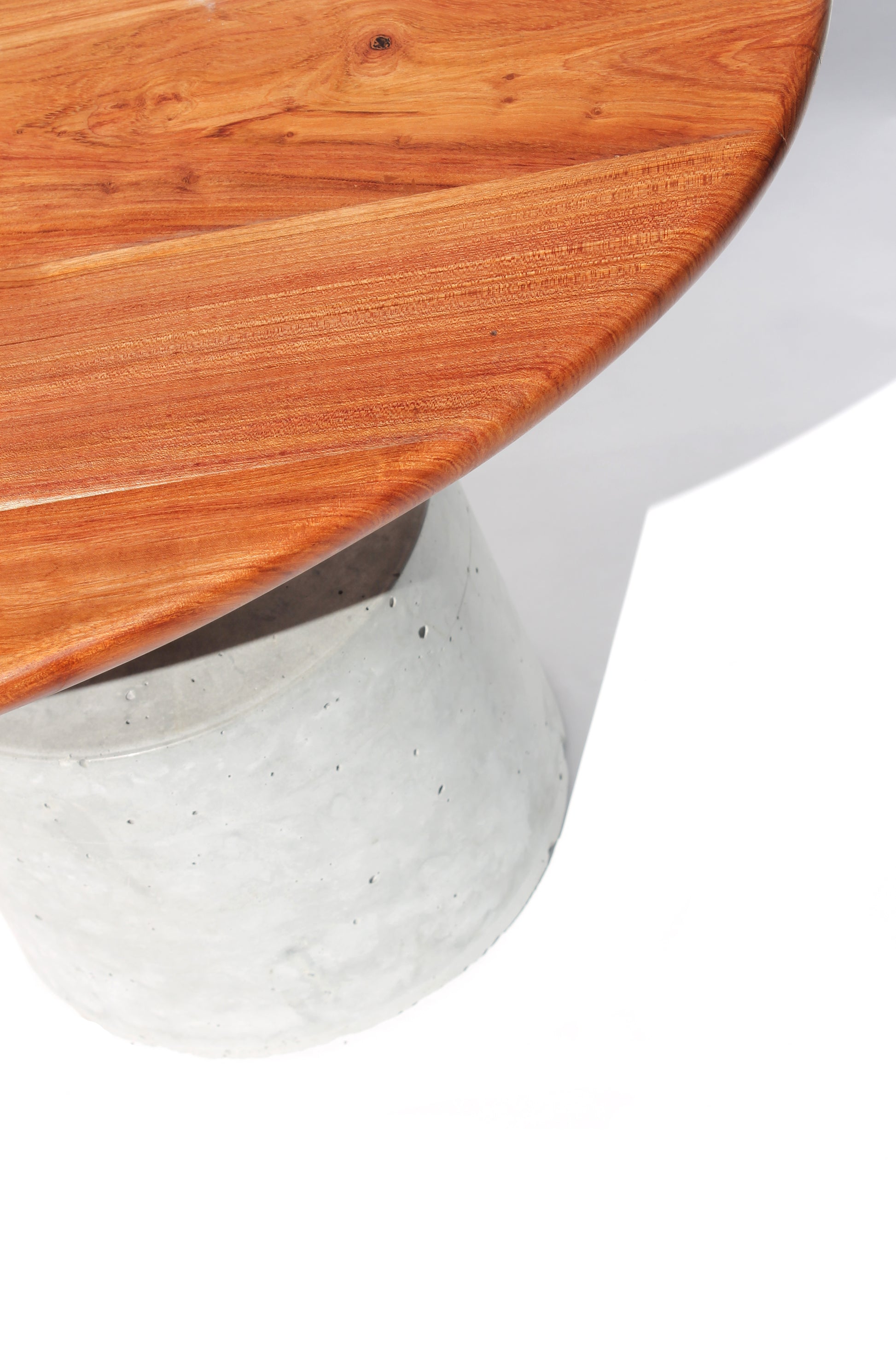 Close-up detail of the Cantilever Coffee Table showing the timber, steel and concrete connection