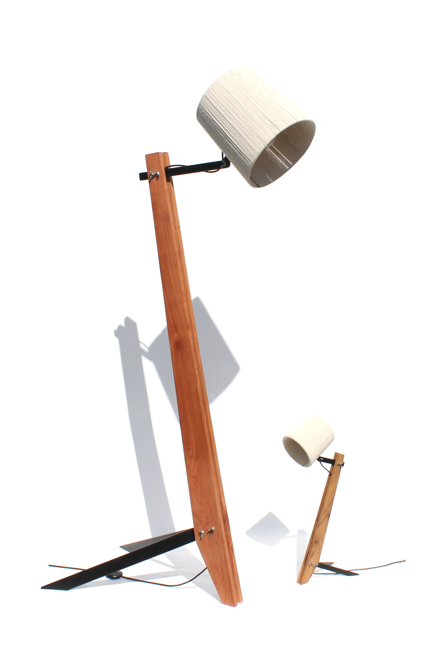 Rosewood and Namibian Teak Industrial Floor Lamps on a white background