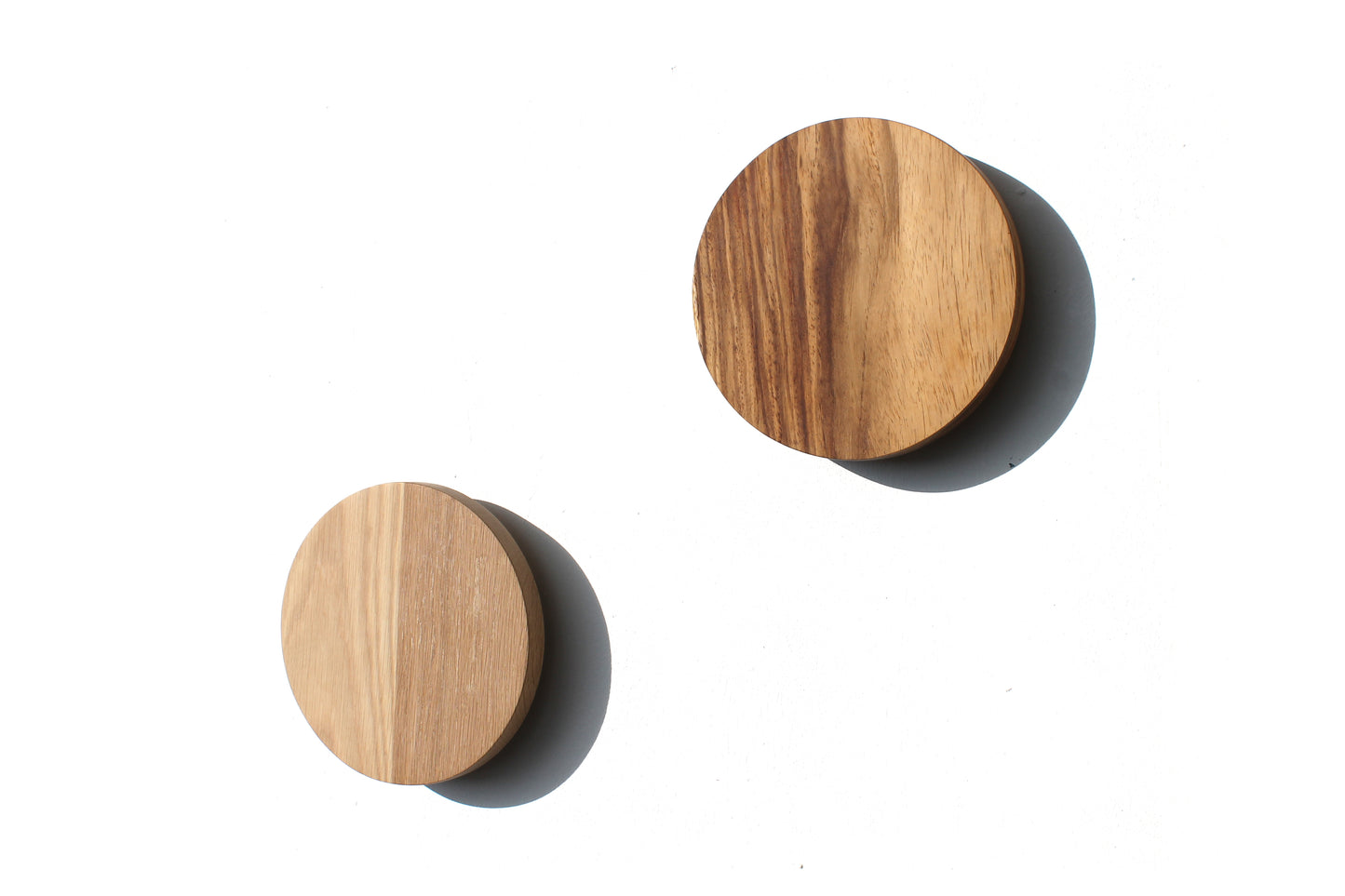 Namibian Teak and Oak Circle Wall Lights on a white background